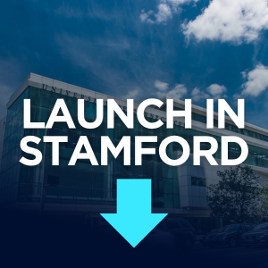 A modern glass building is overlaid with the text "LAUNCH IN STAMFORD" and a large downward-pointing arrow.